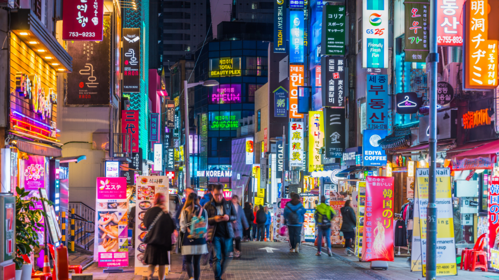 Neon night shopping street Myeong-dong shopping district panorama Seoul Korea